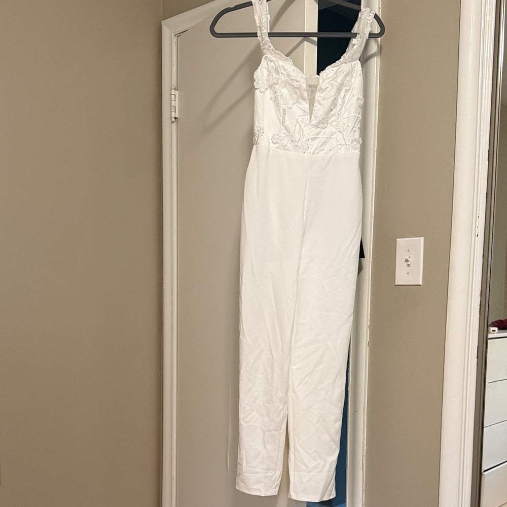 New With Tags Lulu’s Elegant White Lace Jumpsuit with Flower Appliqué
